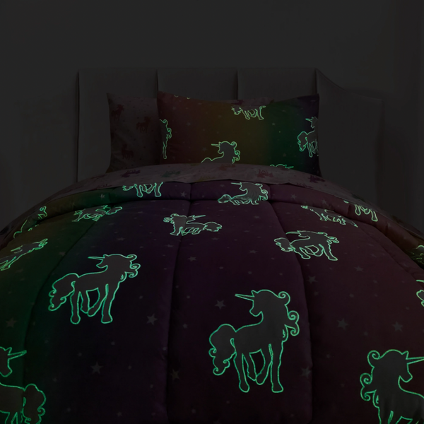 Glow in the dark unicorn comforter shown glowing. stars don't glow. perfect for little girls room